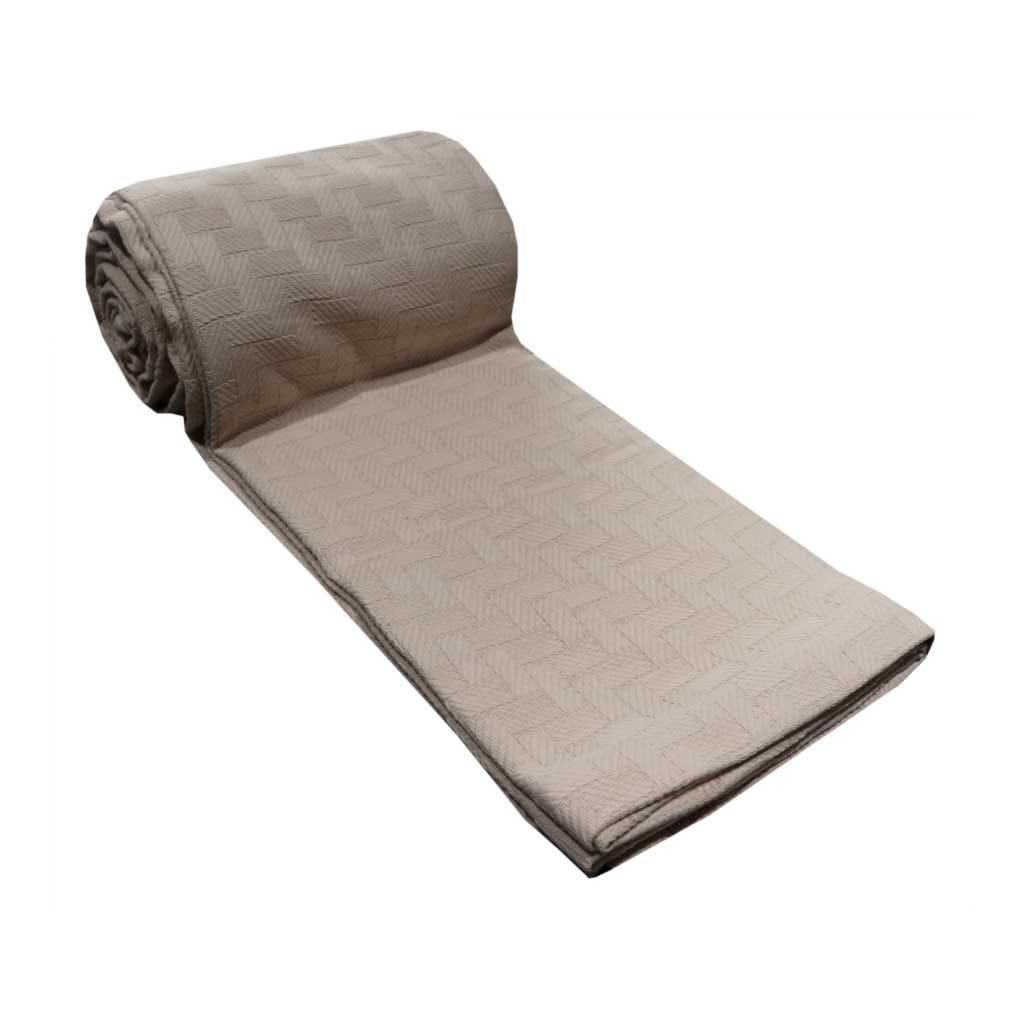 Cubrecama beige de algodón con diseños